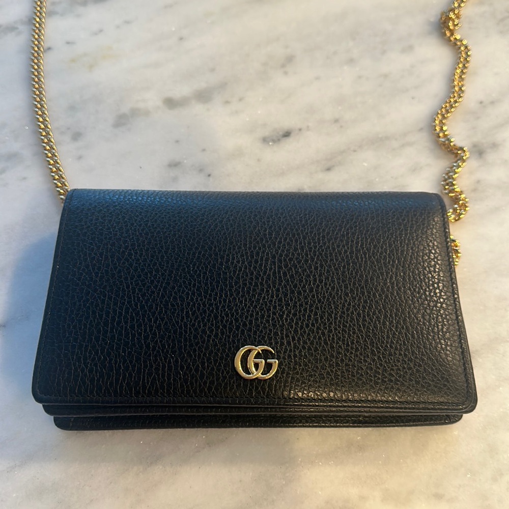 Like new condition Gucci wallet on a chain black with gold hardware
